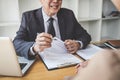 Interviewer or Board reading a resume during a job interview, Employer interviewing a young female job seeker for recruitment