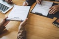 Interviewer or Board reading a resume during a job interview, Employer interviewing a young female job seeker for recruitment Royalty Free Stock Photo