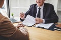 Interviewer or Board reading a resume during a job interview, Employer interviewing a young female job seeker for recruitment Royalty Free Stock Photo