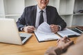 Interviewer or Board reading a resume during a job interview, Employer interviewing a young female job seeker for recruitment Royalty Free Stock Photo