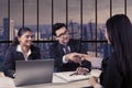 Interviewer shaking hands with new employee Royalty Free Stock Photo
