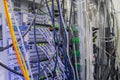 Interweaving a large number of cables in datacenter server room. The rear panel of the rack with servers Royalty Free Stock Photo