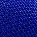 Interwoven pattern featuring tightly knit blue plastic strands. The vivid royal blue color Royalty Free Stock Photo