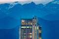 Intesa Sanpaolo tower, night view with the Alps in background.