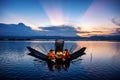 Intha Burmese fishermen on boat catching fish