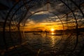 Intha fisherman posing with conical nets at sunset, Inle Lake in the Nyaungshwe Township part of Shan Hills in Myanmar