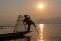 Intha traditional leg rowing fisherman on Inle lake at sunset, Burma, Myanmar Royalty Free Stock Photo