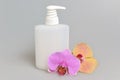 Intimate gel or liquid soap dispenser pump plastic bottle orchid Royalty Free Stock Photo
