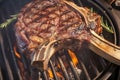 Intimate grill moment Close up of succulent beef tomahawk steak searing