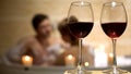 Intimate moment of two lovers, couple enjoying in bath, red wine glasses Royalty Free Stock Photo