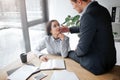 Intimate pictrue of lovely young woman sit at table and look at her boss. He sit on table and touch her cheek. Guy is Royalty Free Stock Photo