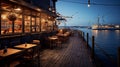 intimate restaurant by the sea night scene, harbor with boats docked Royalty Free Stock Photo