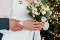Intimate Wedding Embrace with Bridal Bouquet Royalty Free Stock Photo