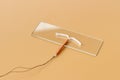 Intrauterine contraceptive device on medical glass. Gynecologist table