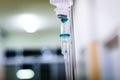 Intravenous therapy iv infusion set and bottle on a pole. Royalty Free Stock Photo