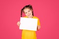 Intresting Offer. Little Girl Holding Blank Placard With Copy Space For Text Royalty Free Stock Photo
