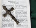 Intricate antique cross with Corinthians verse in Holy Bible Royalty Free Stock Photo