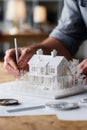 Intricate architectural model design with miniature house and trees on a worktable Royalty Free Stock Photo