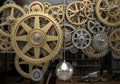 An intricate arrangement of interlocking gears and cogs, varying in size, fill the frame. The gears Royalty Free Stock Photo