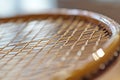 Intricate Badminton Racquet String Pattern Highlighting Design and Tension for Sports Enthusiasts