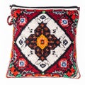 Intricate Beadwork Pillow with Geometric Motifs in Red Black White on White Backdrop Royalty Free Stock Photo