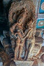 Intricate carving of an amorous couple on bracket figure in cave