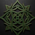Intricate Celtic-style design featuring interwoven green and gold Royalty Free Stock Photo
