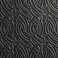 Intricate circular embossed pattern in dark relief, ornamental abstract texture. Royalty Free Stock Photo