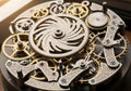 Intricate clockwork mechanism featuring interlocking gears and cogs of various sizes and materials. Royalty Free Stock Photo