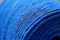 Intricate Close Up of Blue Thread Texture and Pattern on Spool for Sewing or Crafting Projects