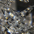 Intricate close-up of a geometric crystal pattern, featuring intersecting triangular Royalty Free Stock Photo