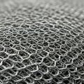 Intricate close-up of overlapping wire mesh, showcasing a hexagonal pattern. The Royalty Free Stock Photo