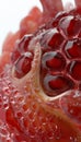 Intricate close up of a pomegranate highlighting its juicy seeds and distinctive form