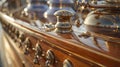 The intricate design of the polished brass and chrome fittings on the sailboat exudes a sense of refinement and opulence