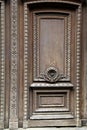 Intricate detail in carvings on face of old wood door