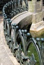 Intricate detail of curving barrier near water's edge