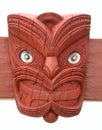 Maori design head carved in wood with paua shell eyes Royalty Free Stock Photo