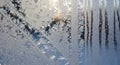 Intricate frost patterns on a window with sunlight Royalty Free Stock Photo