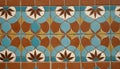 Intricate geometric tile pattern with floral motifs in earthy tones Royalty Free Stock Photo