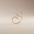 Intricate gold ring with an abstract design, featuring two curved, overlapping bands Royalty Free Stock Photo