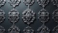 Intricate grey damask patterns with floral motifs repeat on a dark textured wall. Elegant baroque scrollwork creates a luxurious, Royalty Free Stock Photo