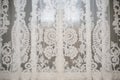 intricate lace detail on a white synagogue curtain