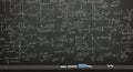 Intricate Mathematical Equations and Formulas Scribbled on a Blackboard Chalkboard Royalty Free Stock Photo