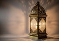 Intricate metal lantern casting warm light Royalty Free Stock Photo