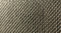 Intricate metal wire mesh with a diamond pattern. The tightly woven wires create a Royalty Free Stock Photo