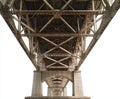 Underside View of a Rusty Steel Bridge Structure with Concrete Pillars on White Background Royalty Free Stock Photo