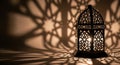 Intricate Moroccan Lantern Casting Beautiful Geometric Shadows on a Wall Royalty Free Stock Photo