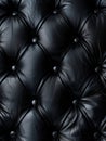 Intricate mosaic of tufted black leather pieces, forming a complex and visually striking geometric pattern.