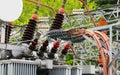 network of high-voltage cables and connectors intertwining with a colossal power transformer within the heart of a power plant Royalty Free Stock Photo