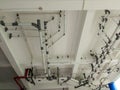 Complex Overhead Piping and Utility Systems on White Ceiling Royalty Free Stock Photo